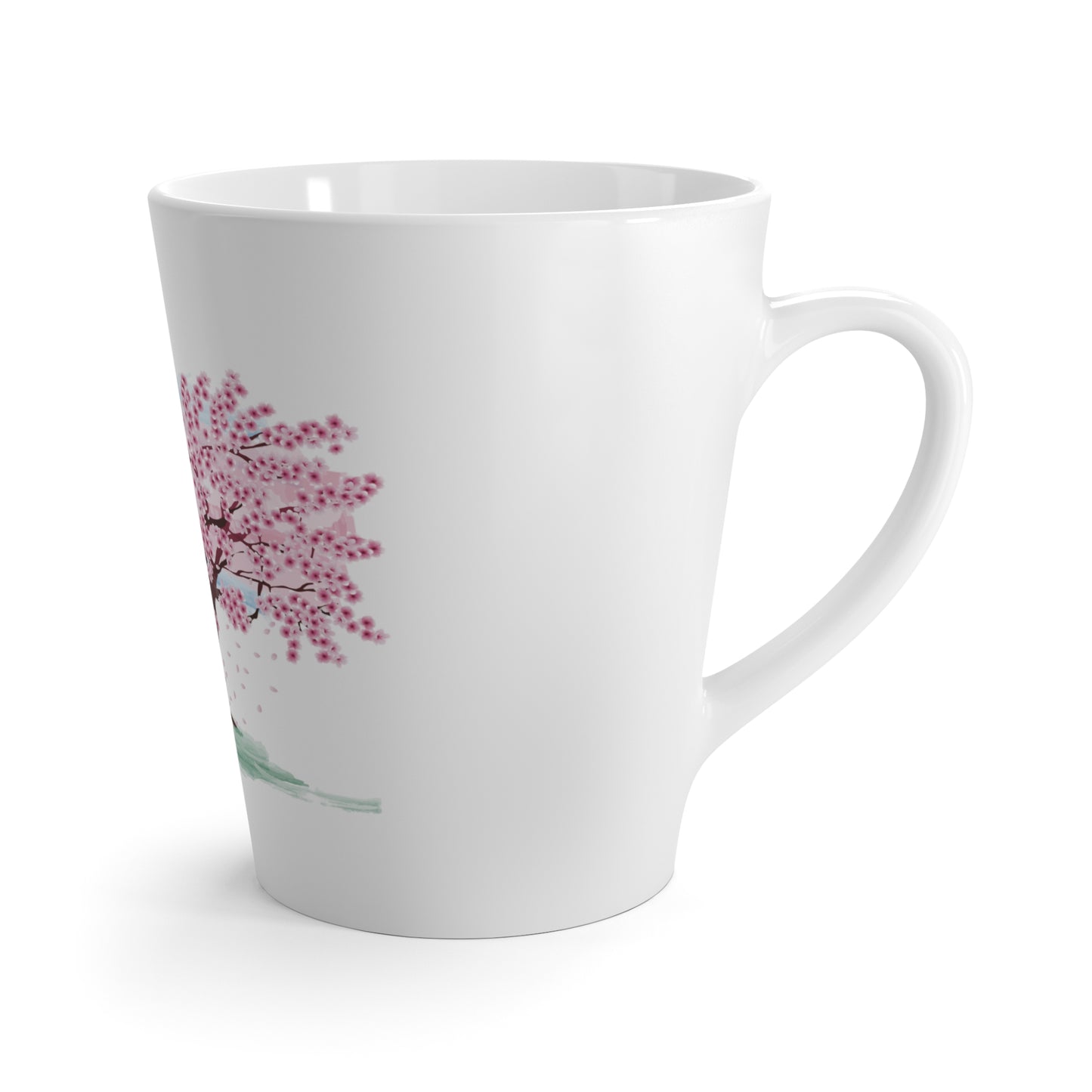 A white latte mug with a pink blossoming tree design with white background.