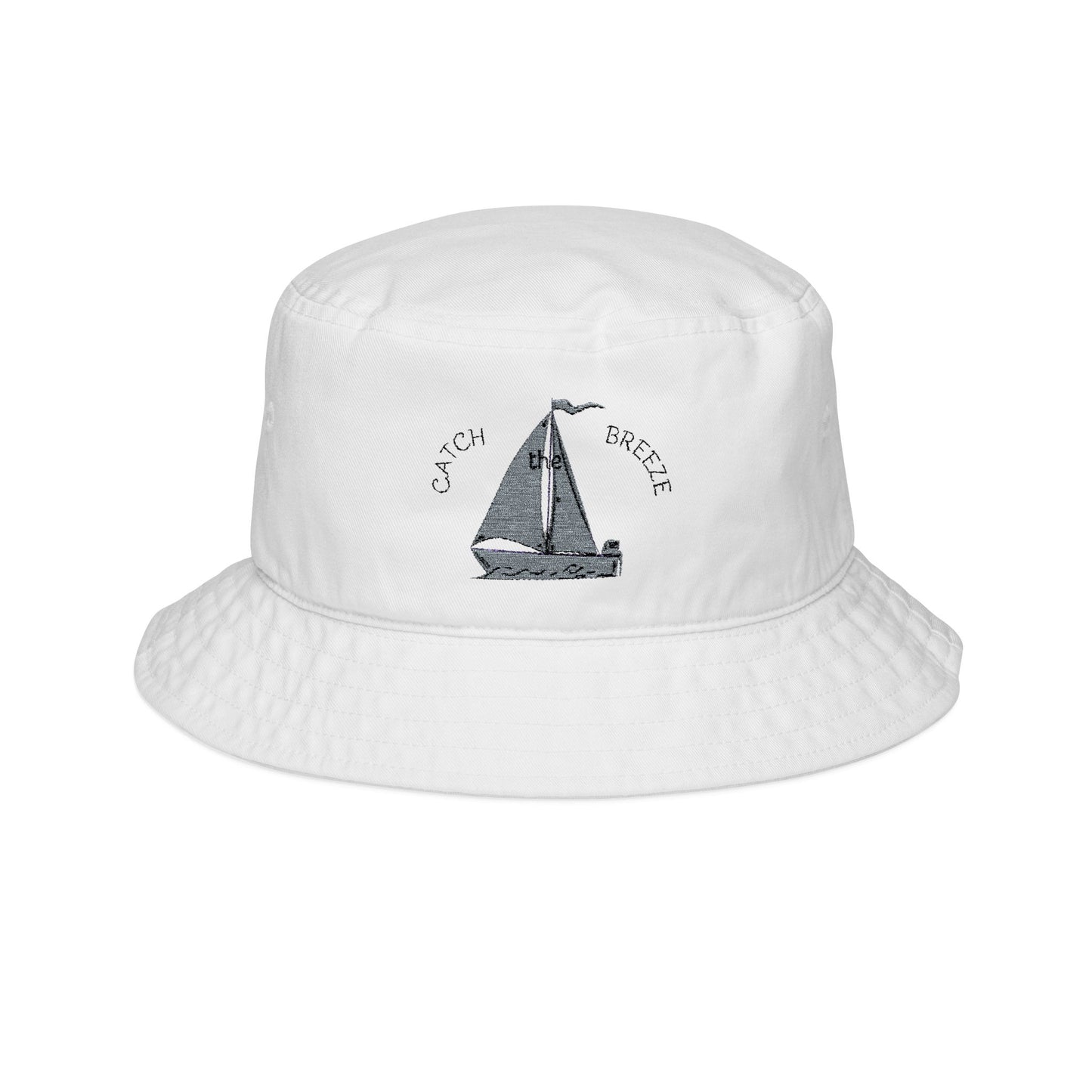 White bucket hat with sailboat design and 'Catch Breeze' text on a white background