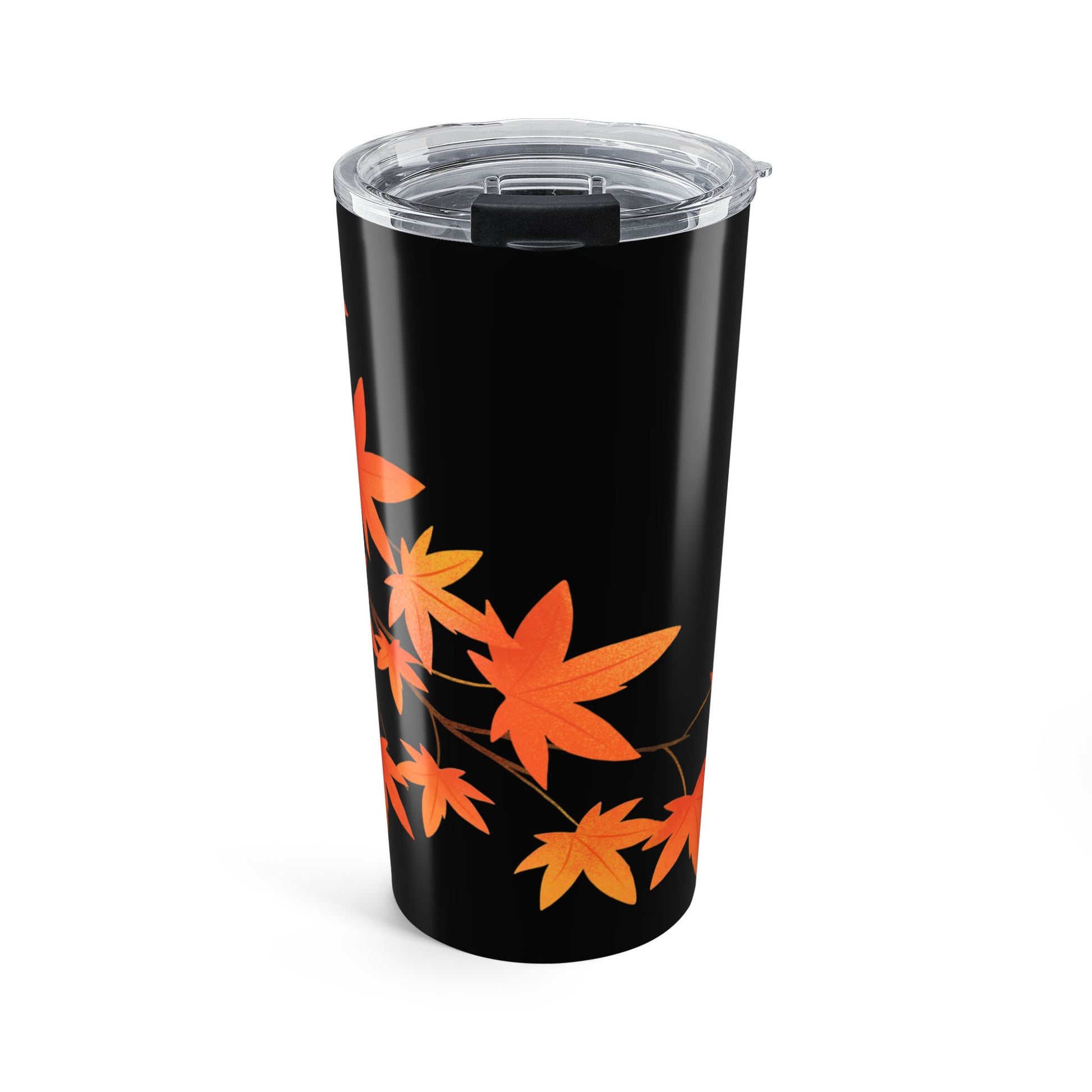 Black tumbler with orange leaf pattern on a white background