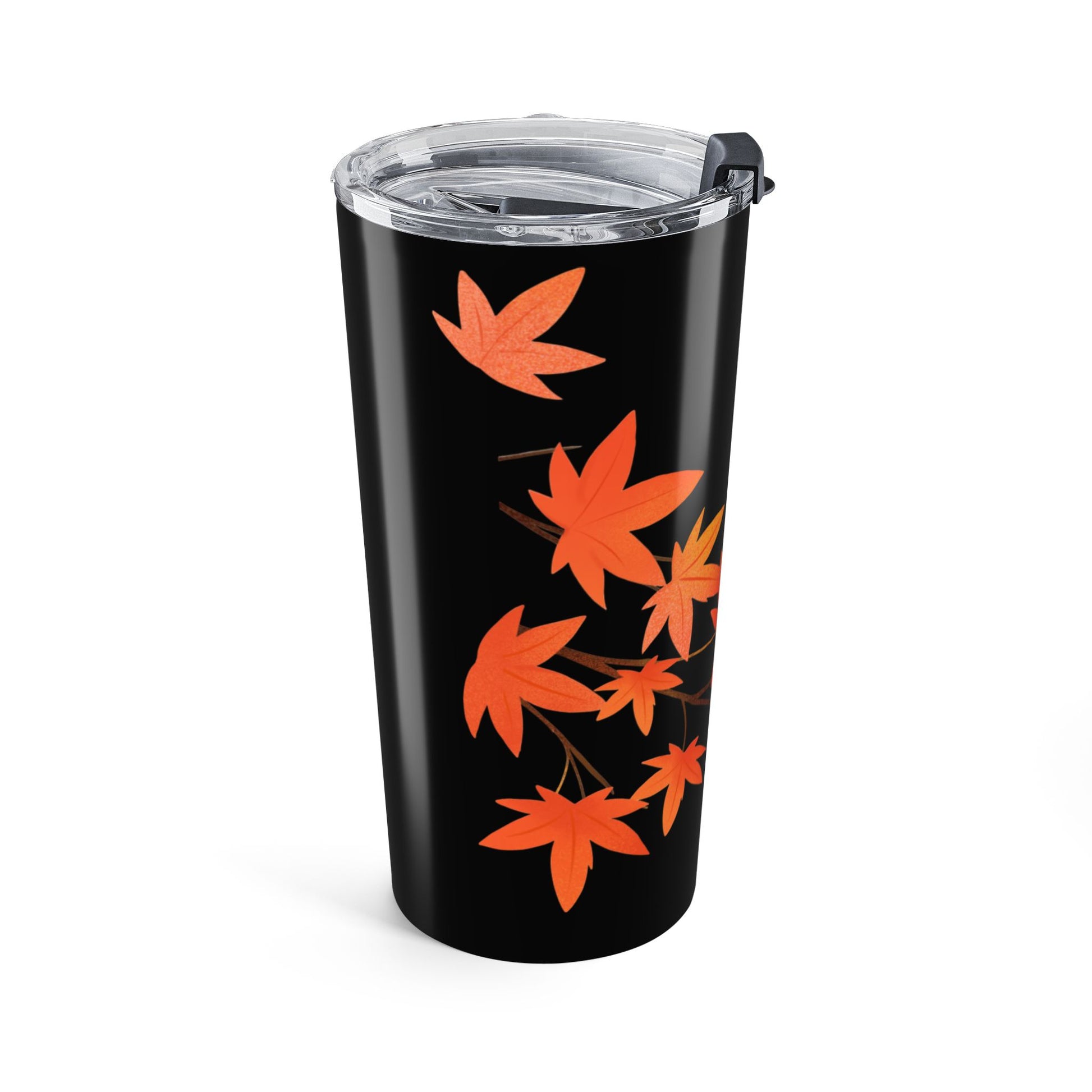 Black tumbler with orange leaf design on a white background
