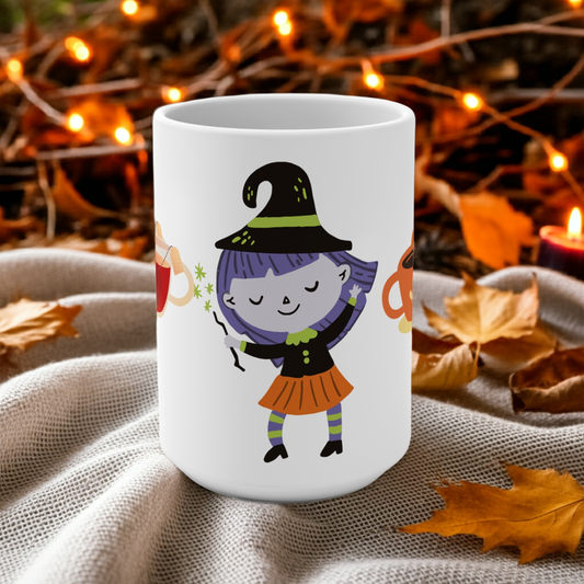 White mug with a cartoon witch design on a fabric background with autumn leaves and lights.