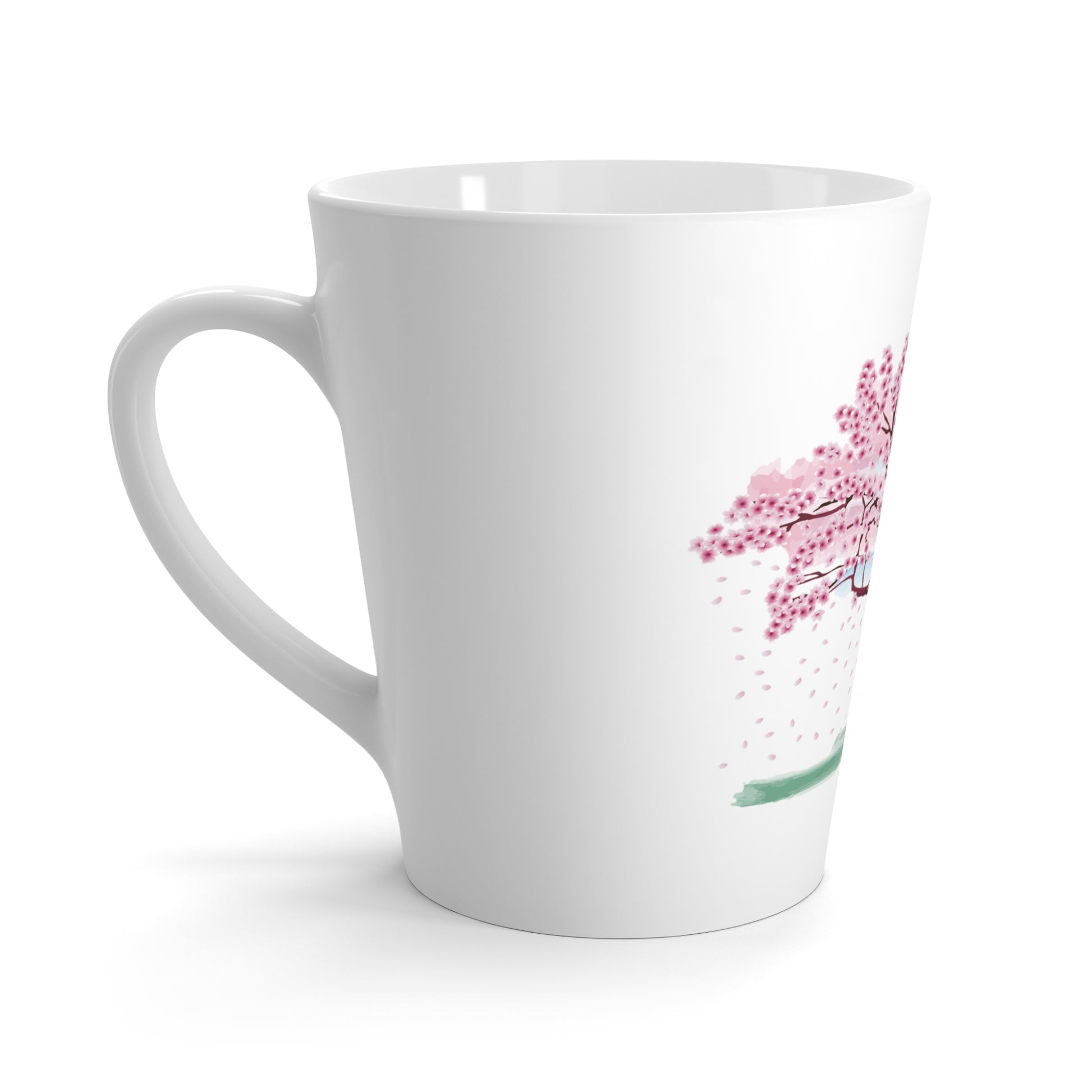 A white latte mug with a pink blossoming tree design with white background.