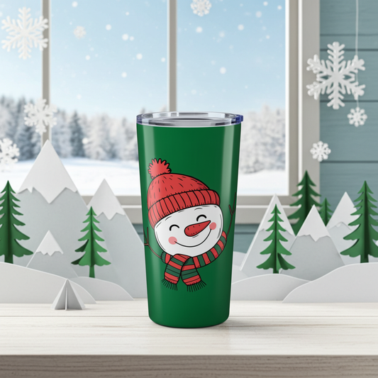Green tumbler with a snowman design in front of a snowy window scene