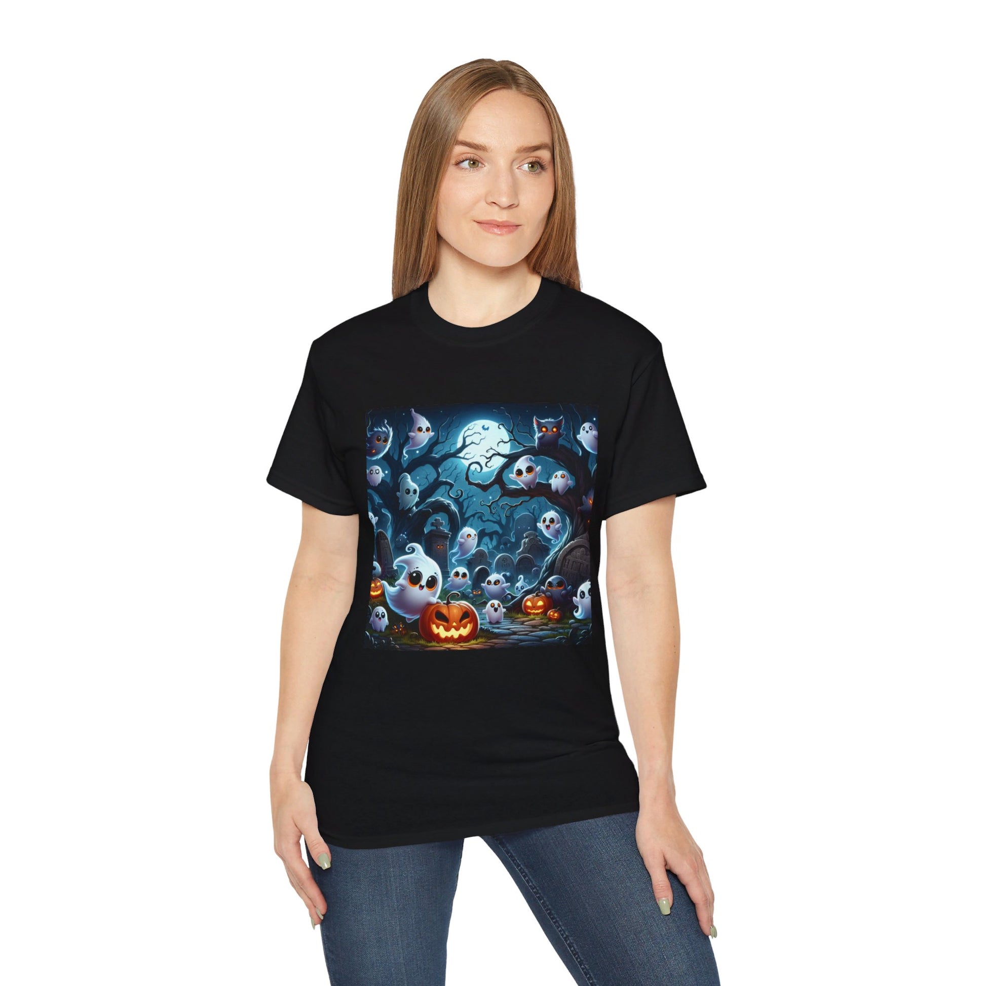 A person in a black t-shirt with a colorful Halloween graphic. The graphic includes multiple cartoon ghosts, a carved pumpkin, twisted trees, and a full moon. The shirt is black, and the background is dark, enhancing the brightness of the graphic elements. The ghosts are white with expressive eyes, and the pumpkin is orange with a carved face. The overall texture of the t-shirt is smooth, and the environment is casual.