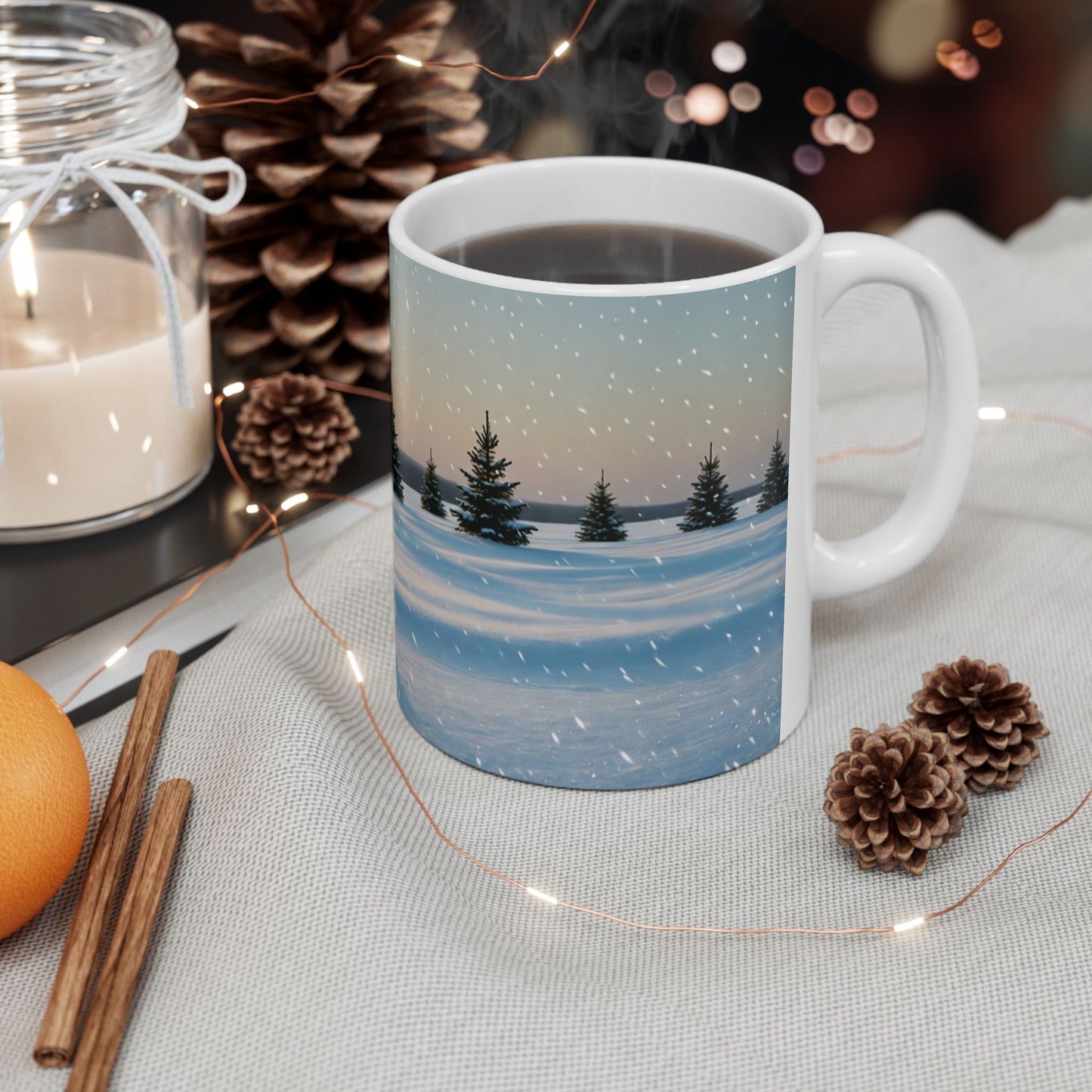 Mug with winter scene design on a table with decorative items