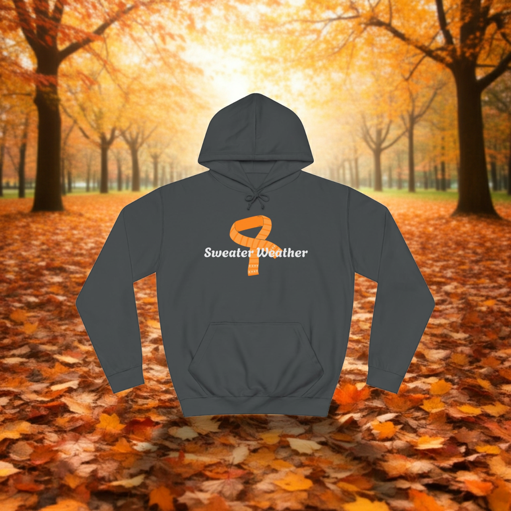 Gray hoodie with 'Sweater Weather' text on a background of autumn trees and leaves