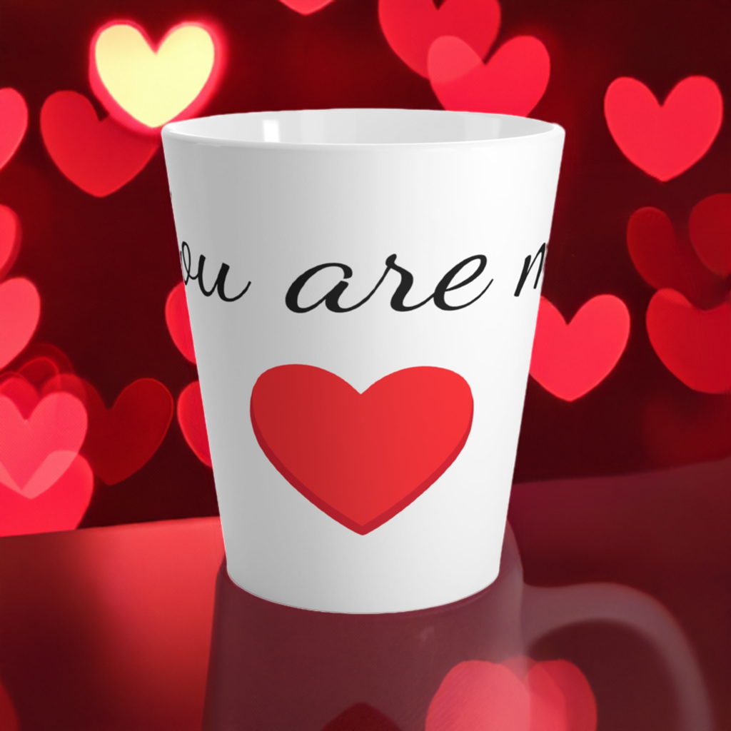 This is a latte mug that says: You are my heart. It has a red heart on it and in the background there are lots of red hearts. 